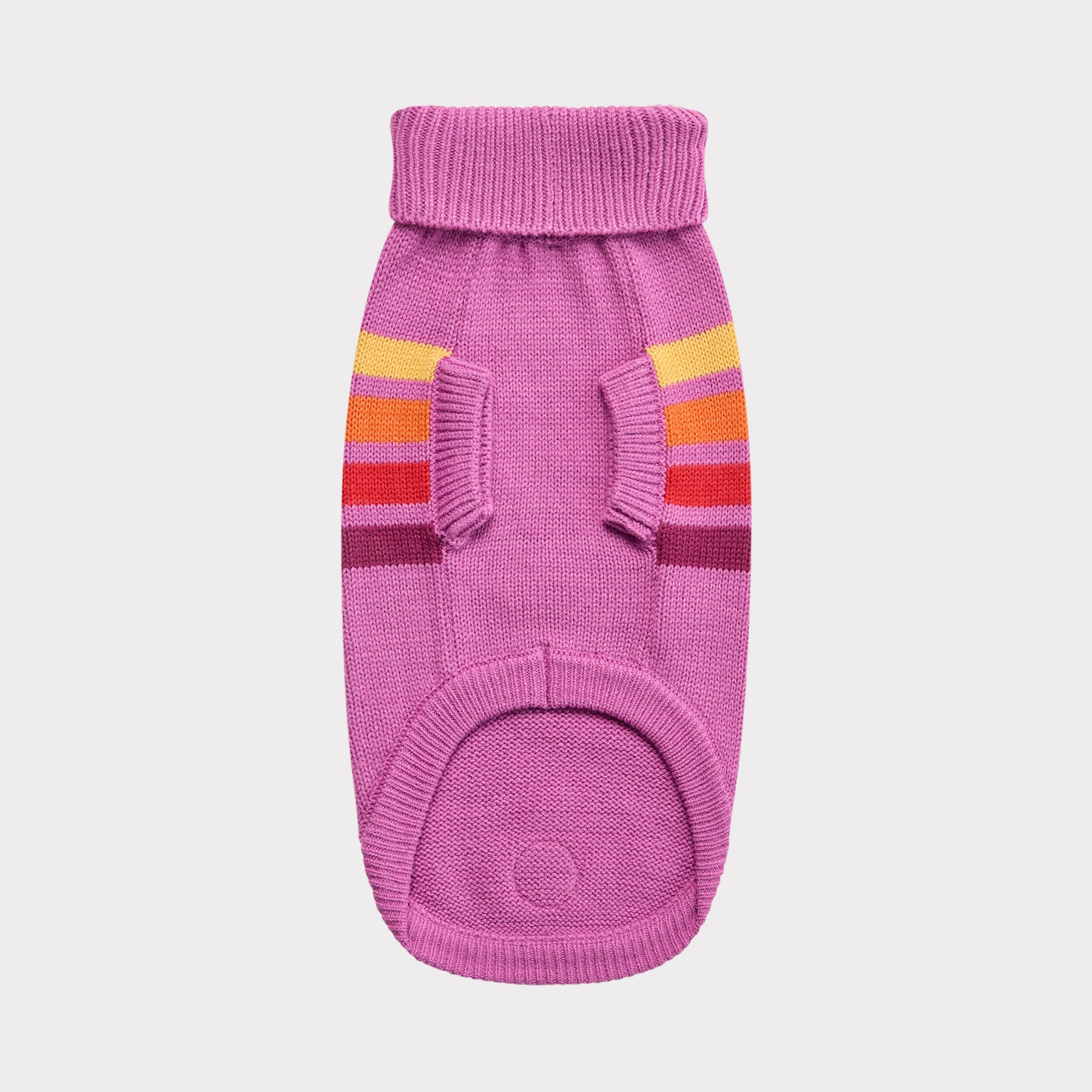 Pink knitted dog sweater with colorful stripes on a light gray background