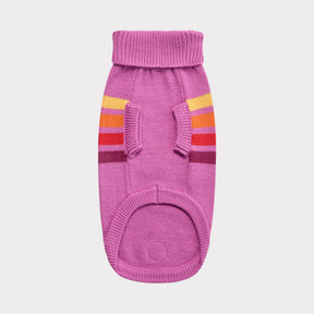 Pink knitted dog sweater with colorful stripes on a light gray background
